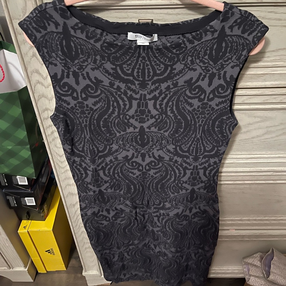 White House Black Market size Med runs big. Tags where removed, but never worn